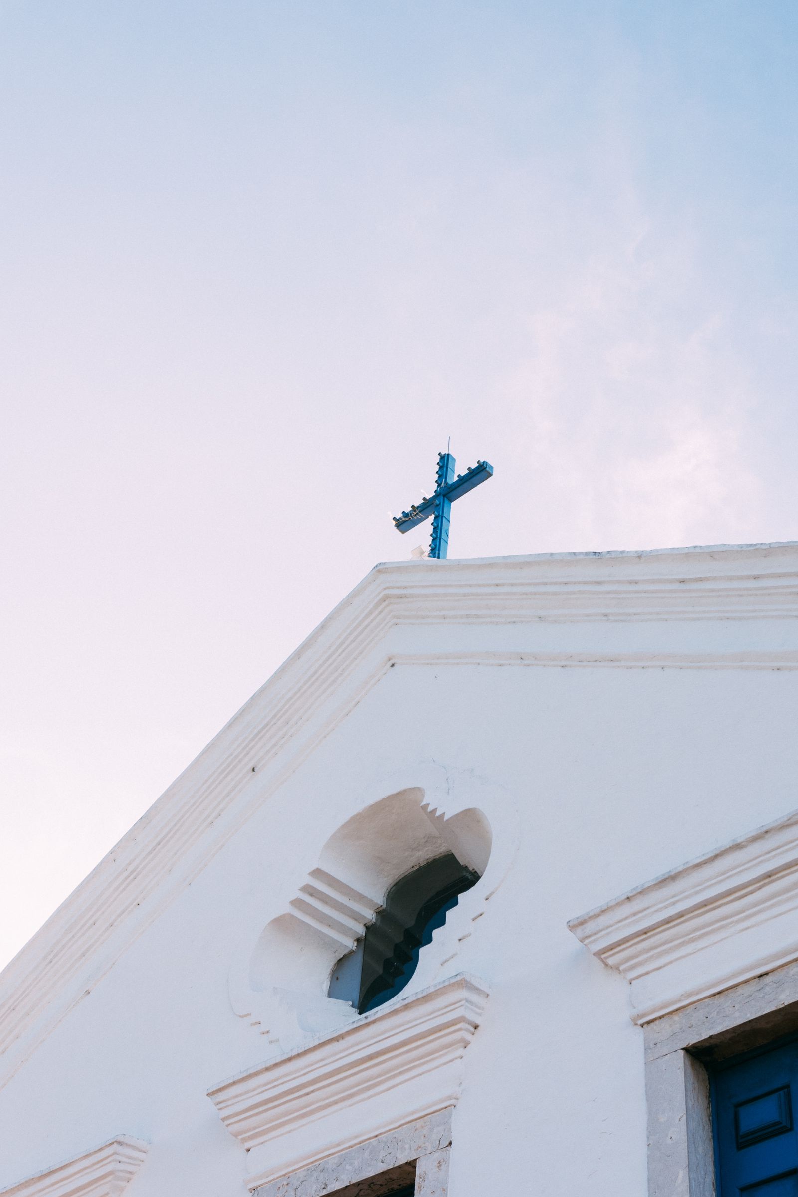 Catholic church exterior beneath a clear sky